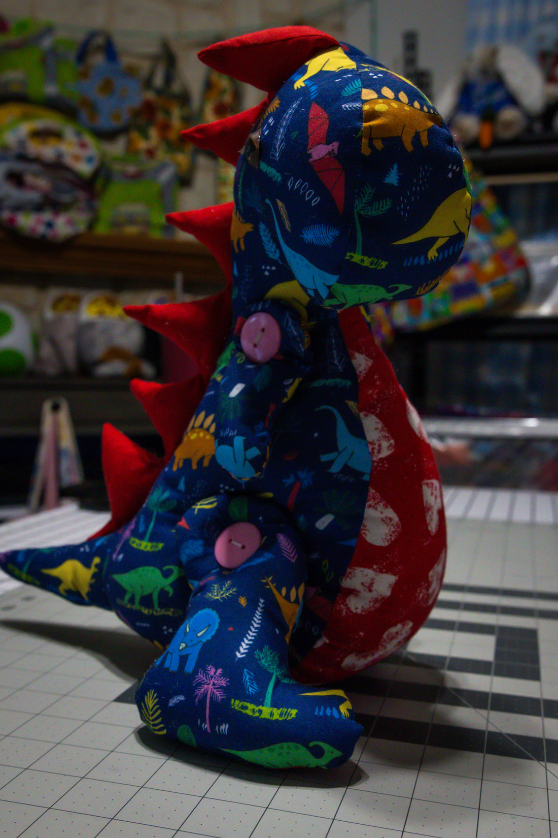 Handcrafted Blue Dinosaur Patterned Dragon Plush with Fiery Red Accents