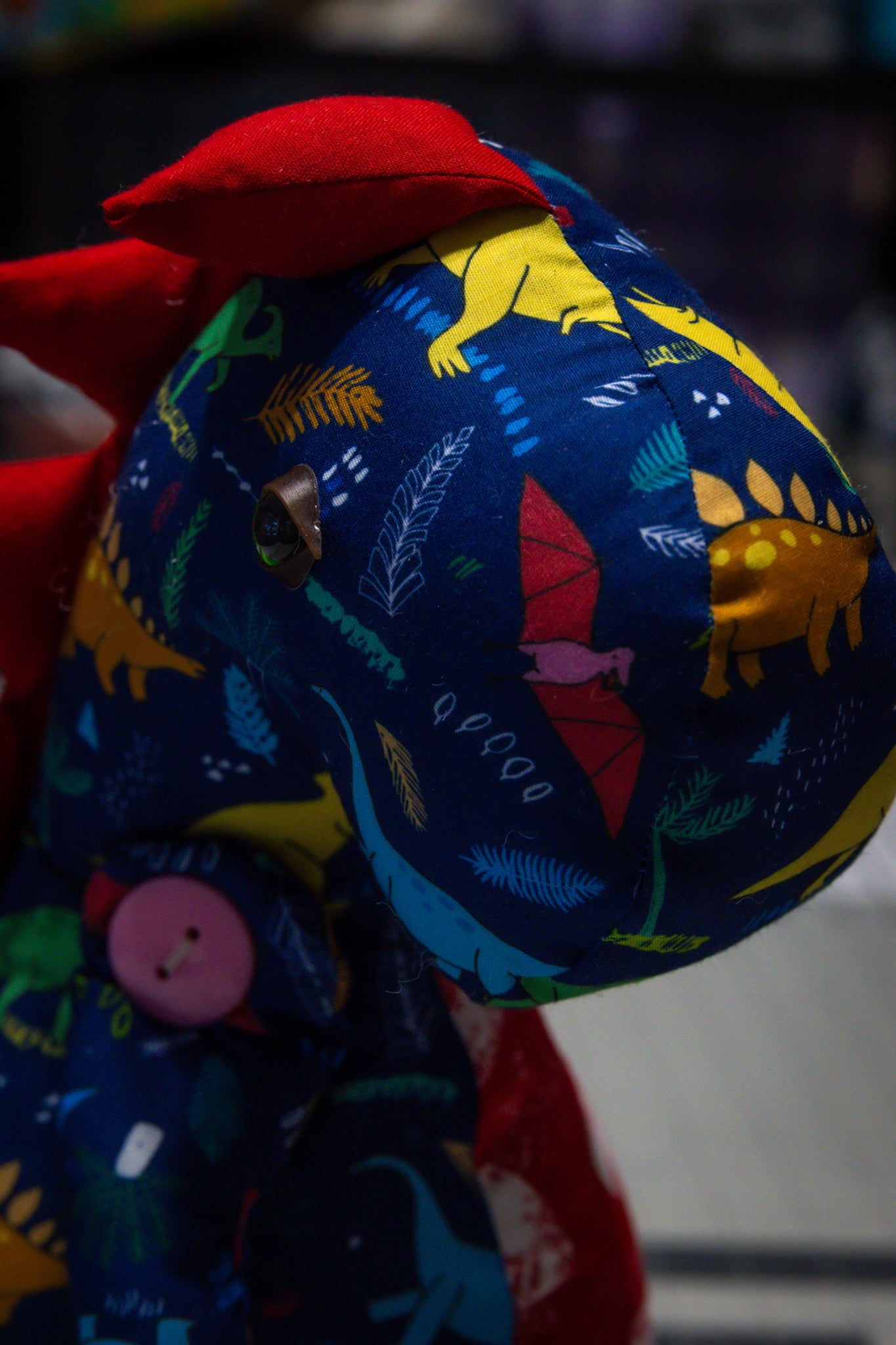 Handcrafted Blue Dinosaur Patterned Dragon Plush with Fiery Red Accents