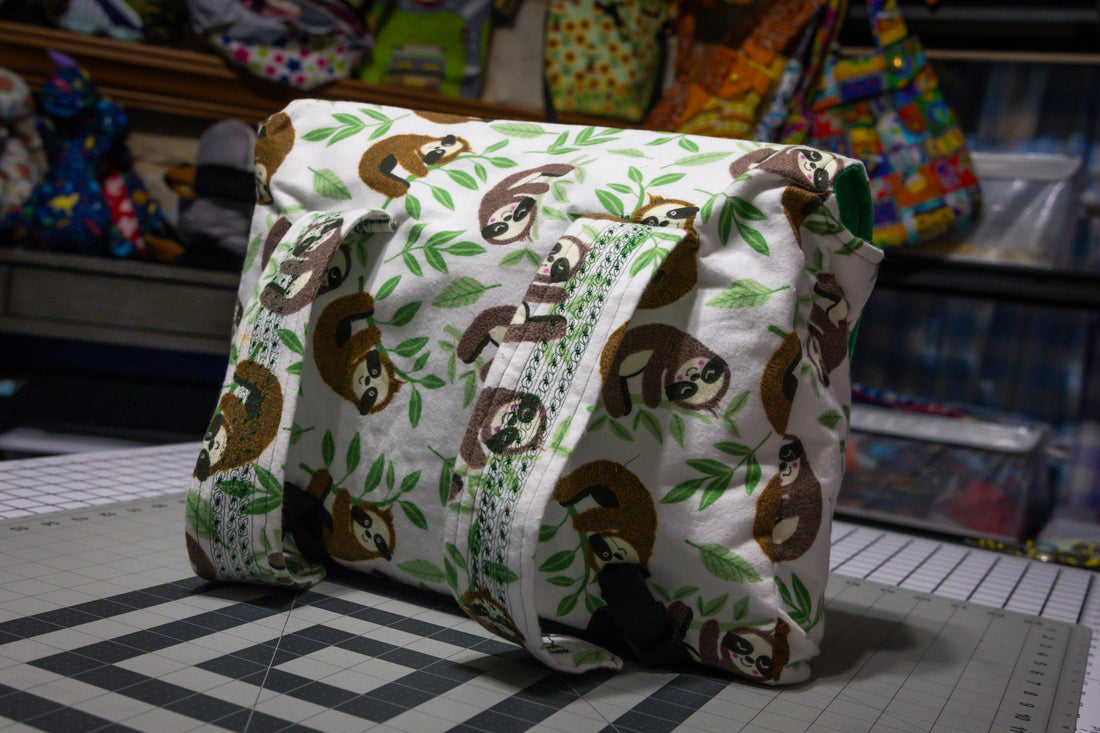 Handcrafted Sloth Pattern Dog Care Backpack with Green Accents and Pet Essentials