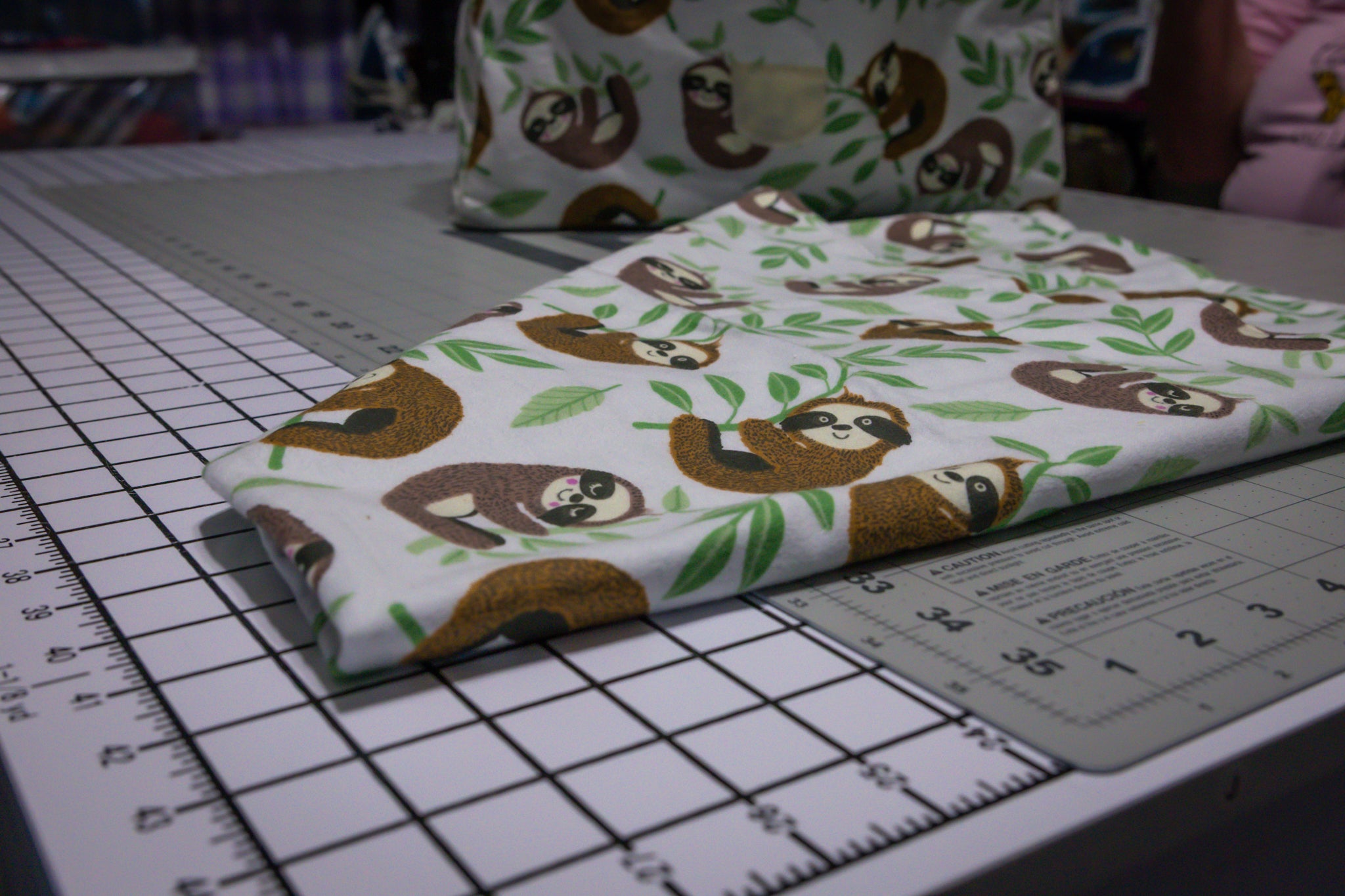 Handcrafted Sloth Pattern Dog Care Backpack with Green Accents and Pet Essentials