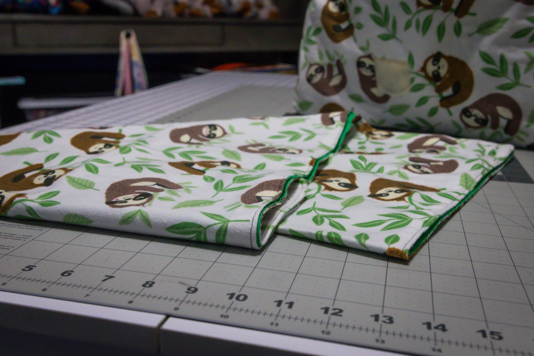Handcrafted Sloth Pattern Dog Care Backpack with Green Accents and Pet Essentials