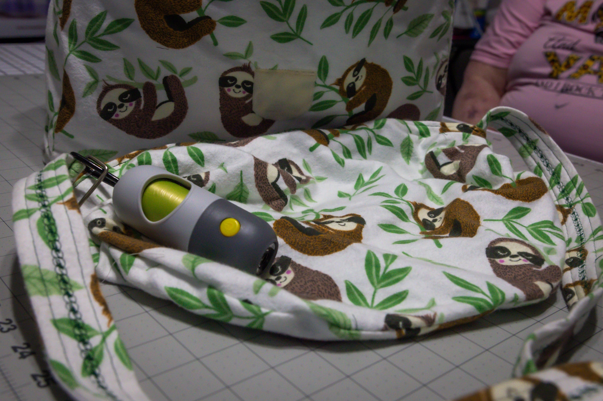 Handcrafted Sloth Pattern Dog Care Backpack with Green Accents and Pet Essentials