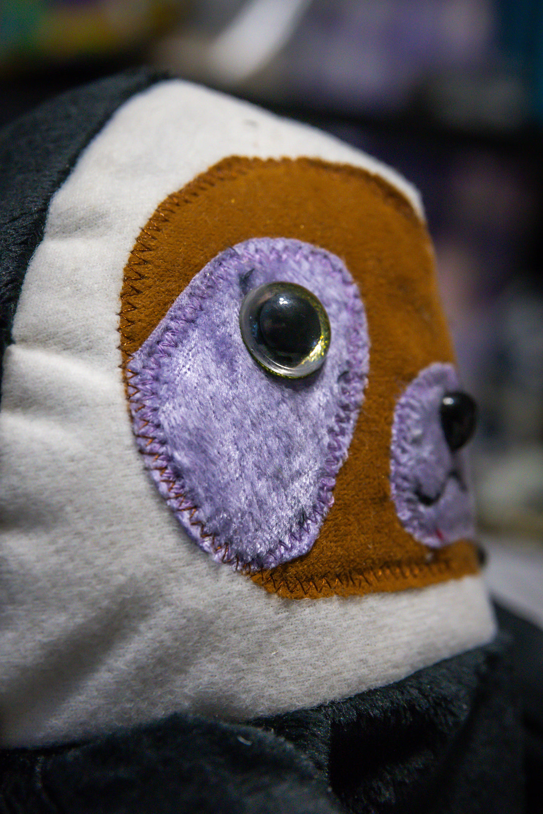 Handcrafted Black Velcro Sloth Plush with Orange Face and Red Eye Accents
