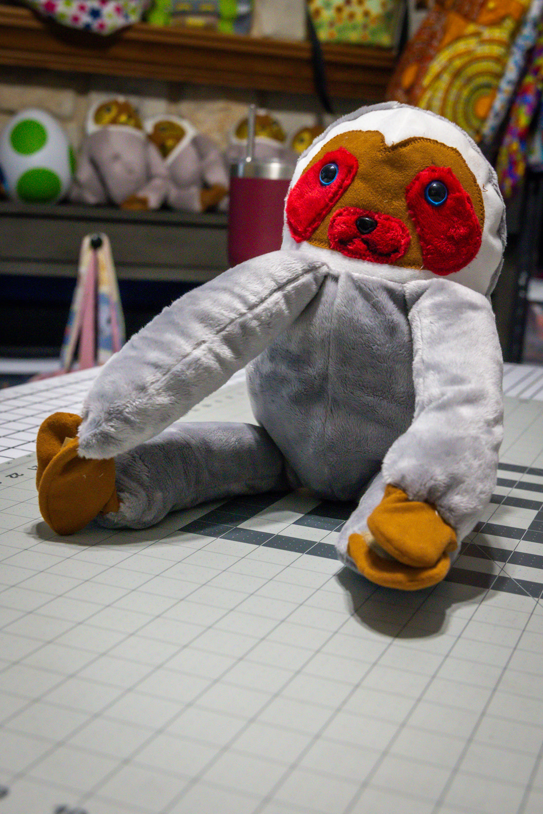 Handcrafted Grey Velcro Sloth Plush with Orange Face and Red Eye Accents